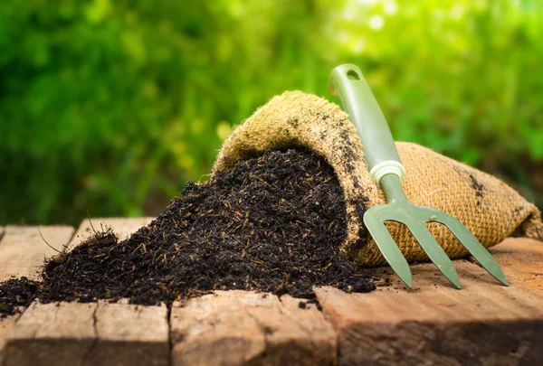 Fertilizer bag over green background, Summer garden concept