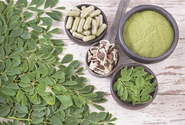 Fresh leaves, powder, capsules and moringa seeds - Moringa oleifera 